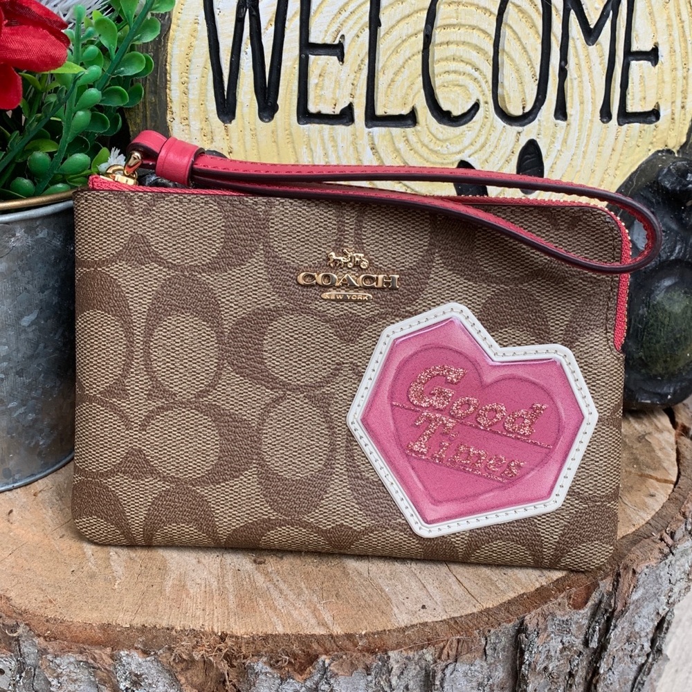 Authentic COACH Signature coated canvas/leather heart( good times) zip wristlet
